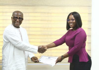 CEO of National Food Buffer Stock Company presenting certificates to participants who completed training on customer service